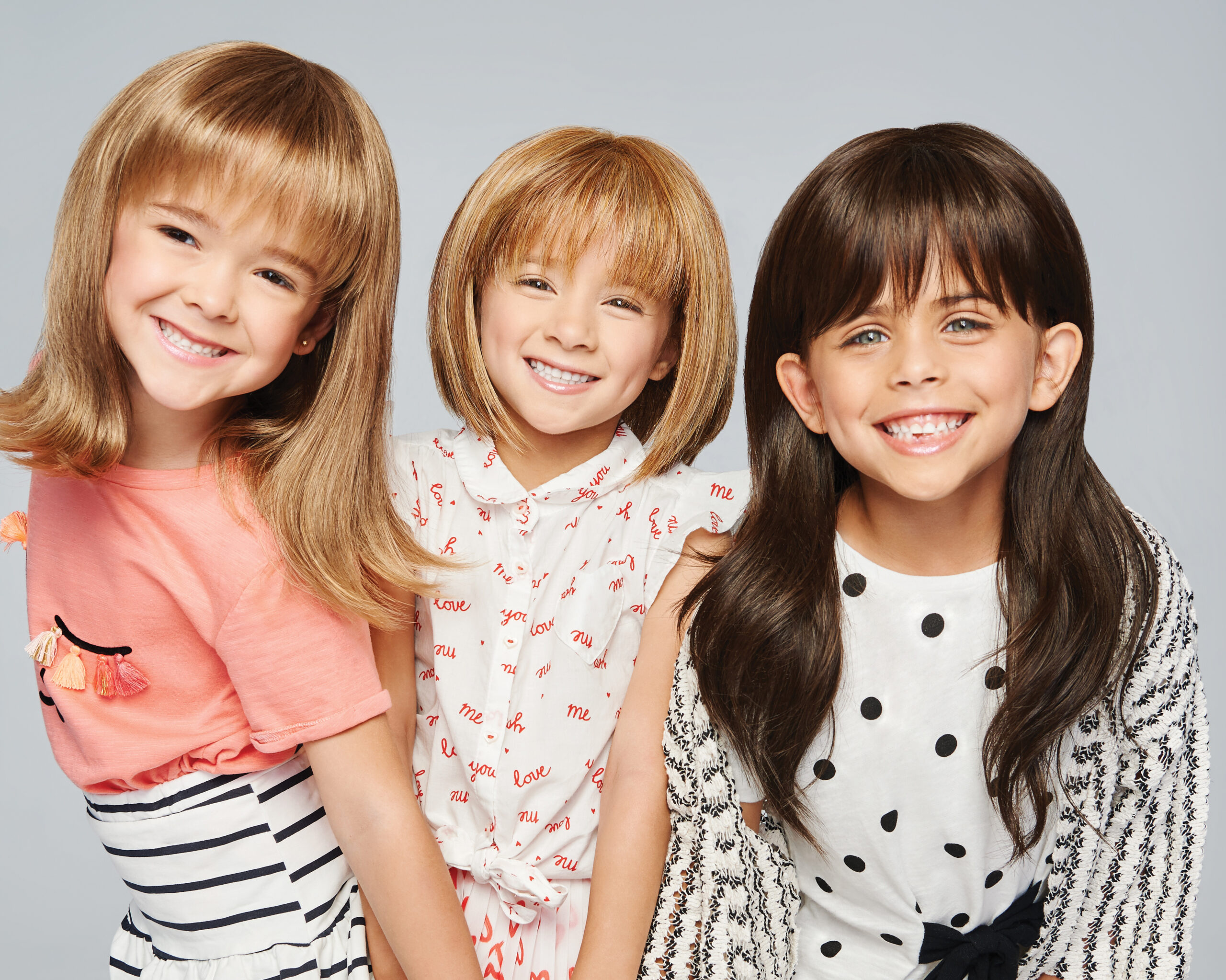 Group of children wearing wigs by KIDZ