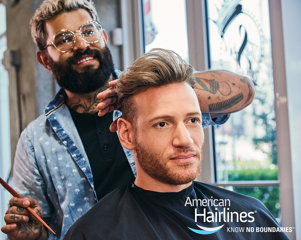 Barber installing men's hair replacement system from American Hairlines